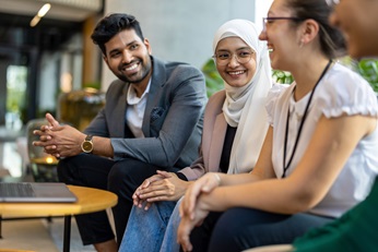 Two women and one men talking