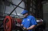 Engineer inspecting a generator.